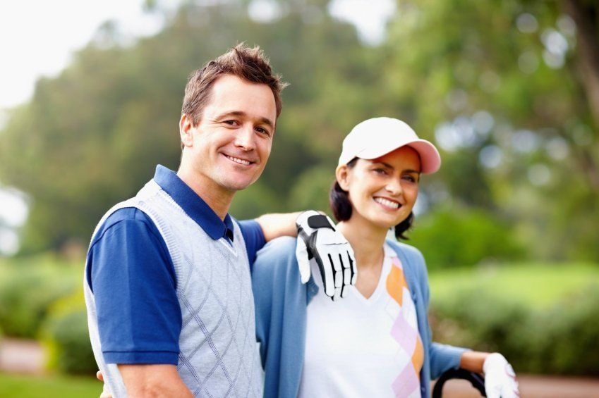 Couple golfing together